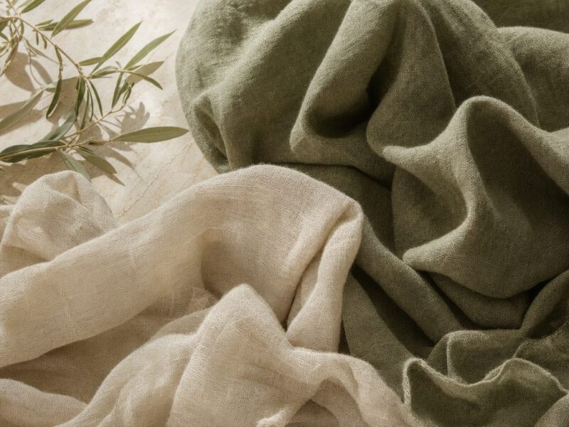 Folded linen fabric showing natural open weave texture